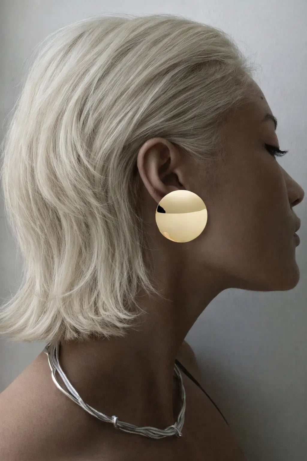 curved gold disc stud earrings
sculptural gold disc earrings
modern gold stud earrings curved disc
architectural gold disc earrings
large curved gold stud earrings