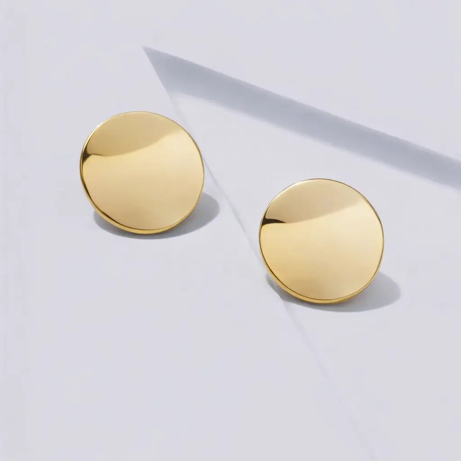 modern gold stud earrings curved disc
architectural gold disc earrings
large curved gold stud earrings