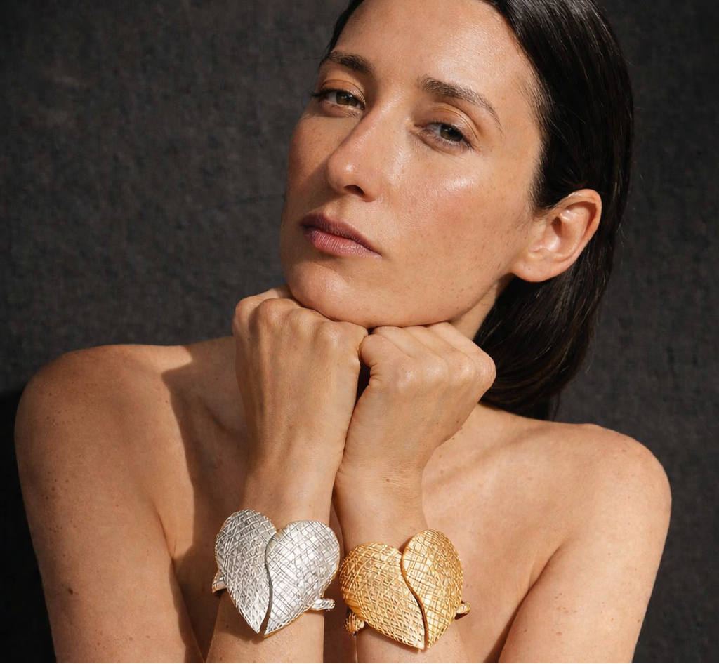 Oversized gold heart statement cuff bracelet with crosshatch texture detail
