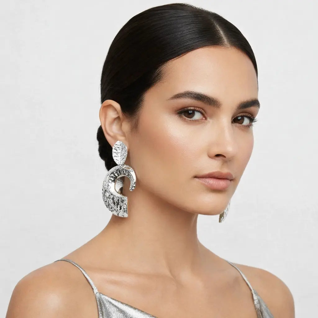 melted metal clip-on earrings silver
oversized sculptural clip-on earrings
Silver Earrings